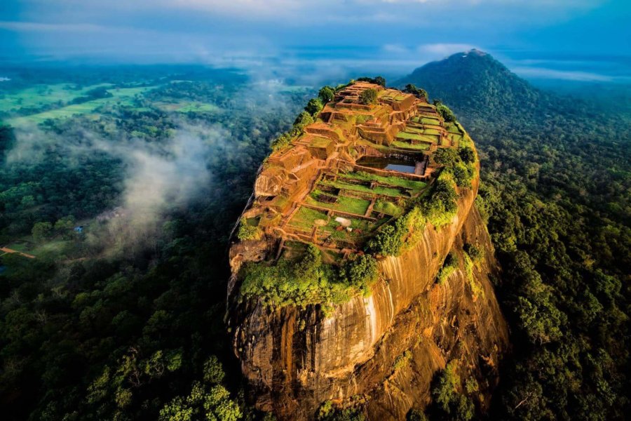 Aerial view of the Sigiriya rock fortress rising above the forest