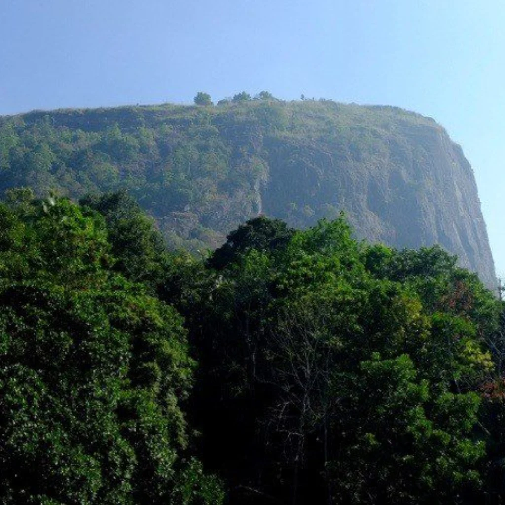 Bathalegala, a steep rock face rising above the forest