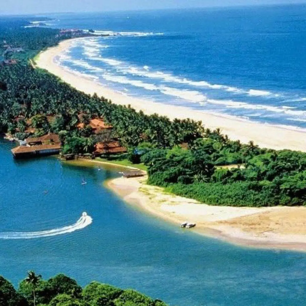 Aerial view of a long sandy beach, river mouth and lagoon at Bentota