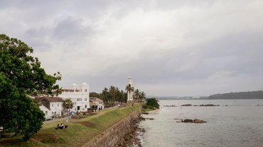 Galle Fort lighthouse and ramparts by the sea