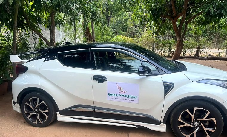 Lanka Tour Host Toyota C-HR with the company name on the door
