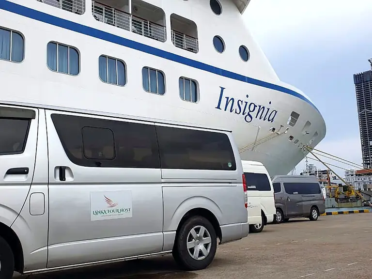 Lanka Tour Host van in front of a cruise ship in Colombo