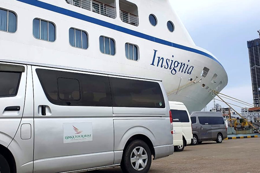 Lanka Tour Host van in front of a cruise ship in Colombo