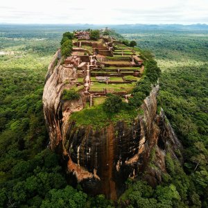 Sigiriya rock fortress rising above the forest, seen from the air